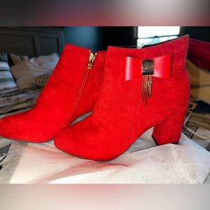 Red boots with bow and gold dangle chain